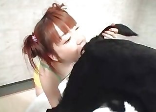 Redheaded Japanese girl slurps dog ass