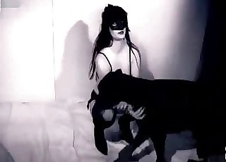 Stunning woman and a black mutt are having sex together
