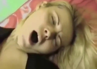 Blond-haired lady near X outfit rides a dog