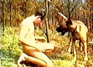 Dude seducing his own dog in the forest