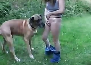 Thong-wearing slut seducing a dog outdoors